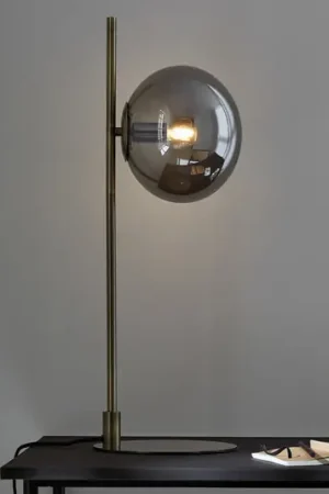 Compra Adesso Lampada da tavolo Dione, ottone/grigio fumo, vetro, ferro